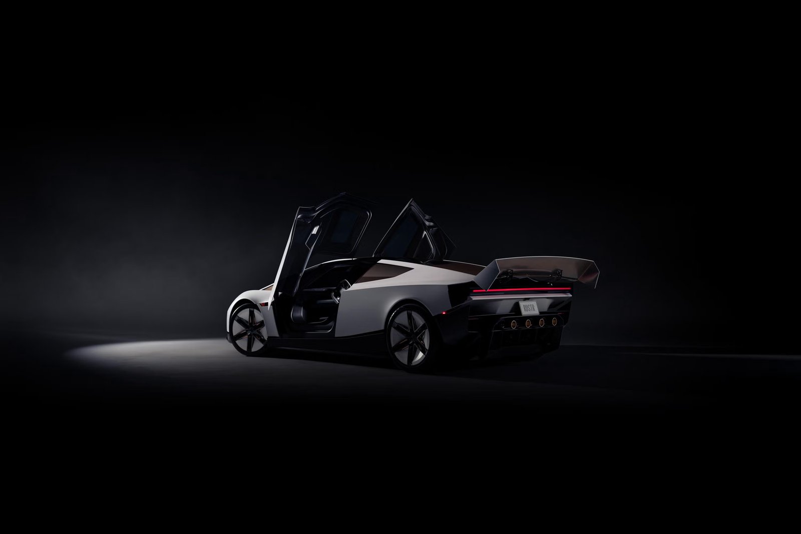 The new white Tesla Roadster with both doors open and a large rear wing, in a dark studio